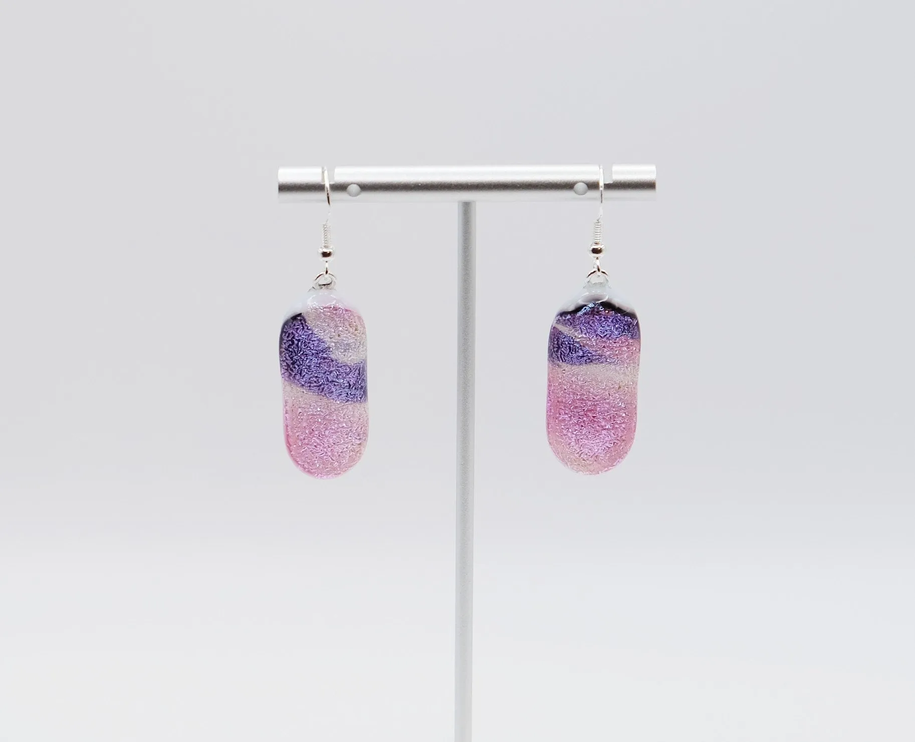 Dichroic pink, purple and white sparkling fused glass pierced dangling earrings on silver french wires. Approx 2 inches total length