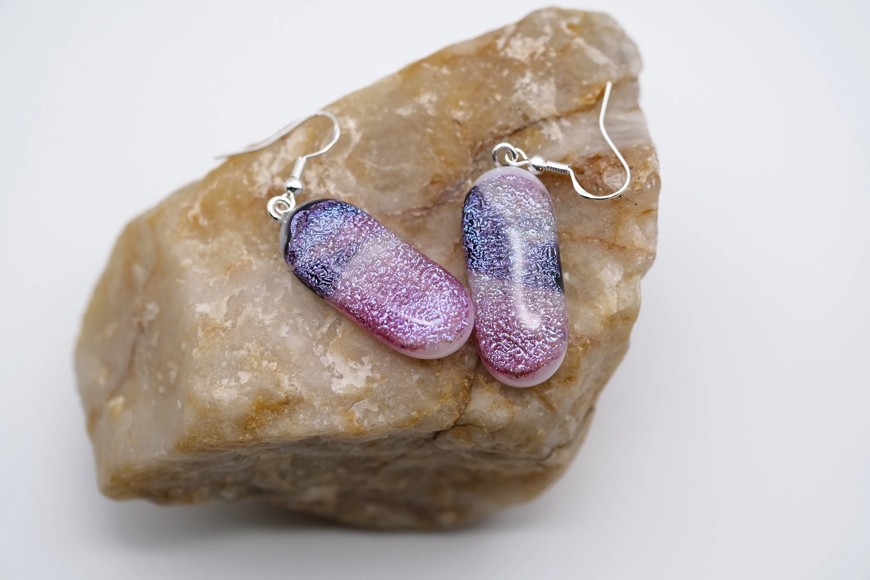 Dichroic pink, purple and white sparkling fused glass pierced dangling earrings on silver french wires. Approx 2 inches total length